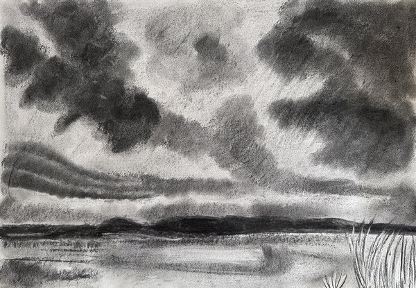 Charcoal landscape of heavy clouds over a marsh